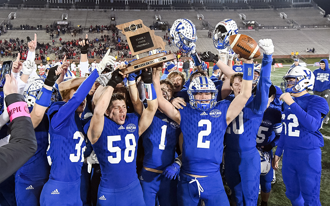Valle Catholic's Brian Dunlap (2) and Peyton Tucker (58) hoisted the Class 1 championship trophy with teammates after the MSHSAA Class 1 State championship football game against Lincoln High School on Saturday, Dec. 7, 2019, at Faurot Field in Columbia, Mo. 
