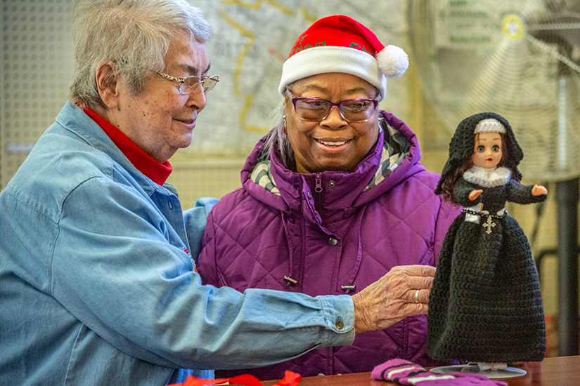 Carlyn Foster delivered a handmade crocheted doll of the Religious Sisters of Mercy as a Christmas present for Sister Carol Ann Callahan, RSM. Sister Carol Ann is the director of the St. Augustine-Wellston Center, which operates an annual Christmas store for residents.