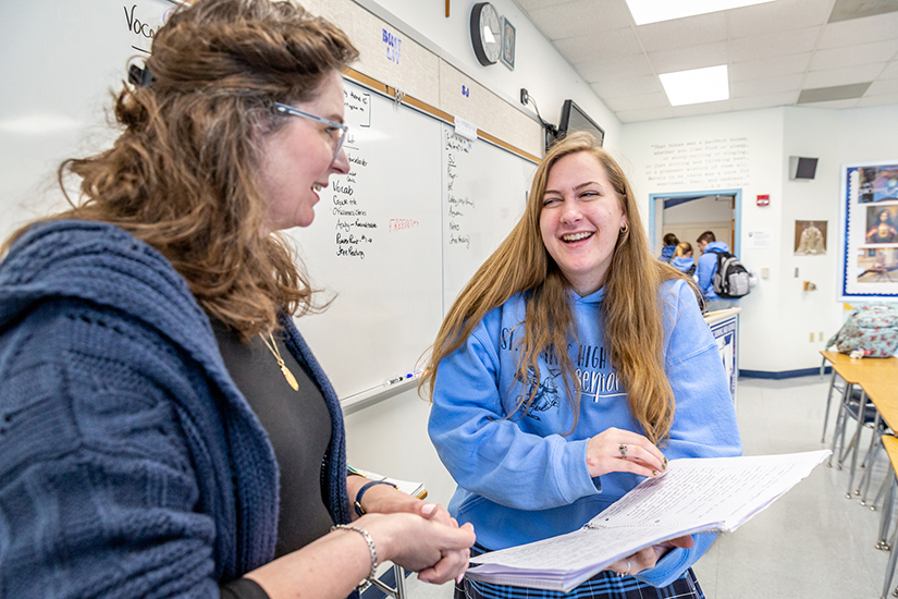 Hanna Vanourney excitedly showed teacher Denise Bossert how many notes she took during apologetics class at St. Dominic High School Jan. 13. “I’m in campus ministry,” she said, “and I never heard any of this stuff before today!”
