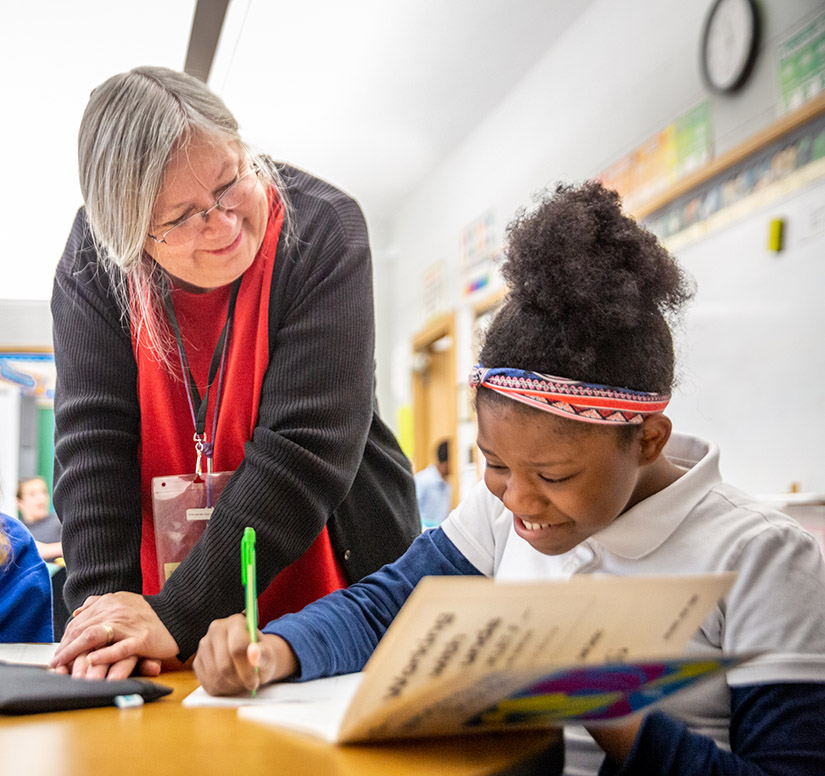 Vicki Houghton helped Bre’lle May during class at Annunziata Learning Center in Ladue. Annunziata is one of the locations for students in the archdiocese with learning disabilities, ADHD, speech and language deficits and autism-spectrum disorders.
