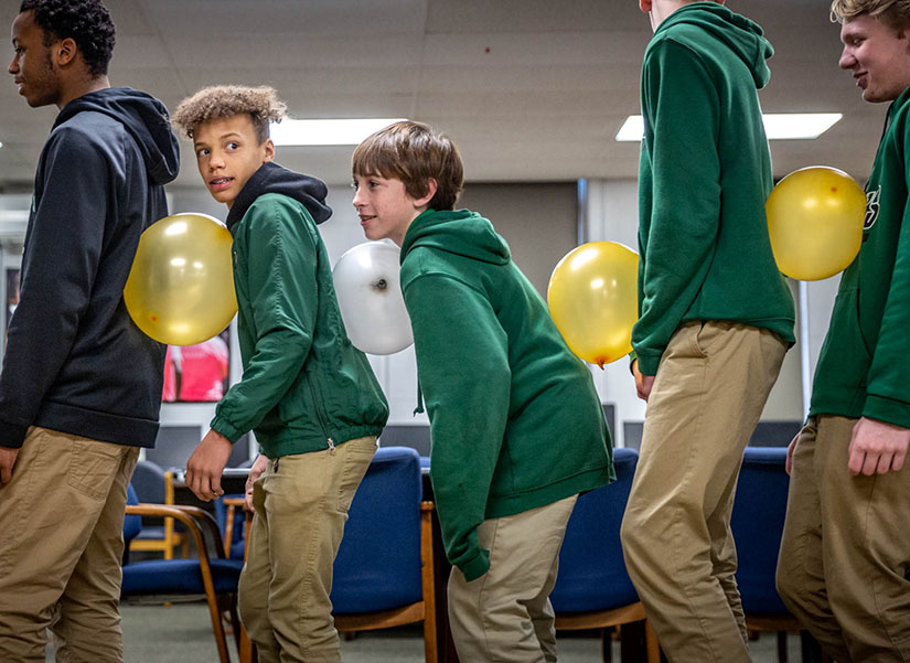 Freshmen students in the leadership program at St. Mary’s High School participated in an activity about servant leadership during a seminar at the school Jan 30. The students are, from left, Deron Gipson, Tony Valentine, Matthew Flowers, Drew Richter and Alex Kurkowski.