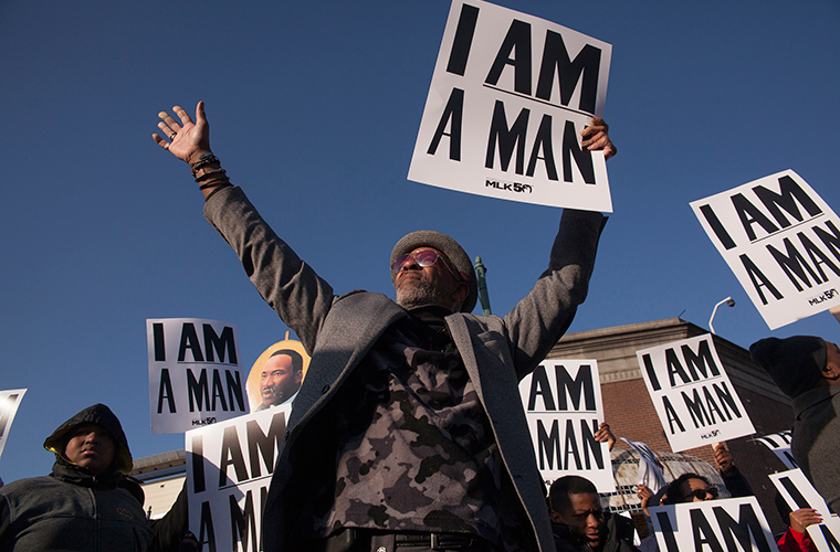 People marched along Beale Street in Memphis April 4 to commemorate the 50th anniversary of Rev. Martin Luther King Jr.’s assassination. The signs are reproductions of those carried in the 1968 sanitation workers strike, which King had been in Memphis to support when he was killed.