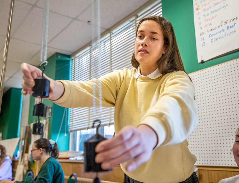 Emma Mueller is among finalists at a St. Louis science fair for her research on the effects of long-term, low-dose ionizing radiation. She worked on an experiment at St. Joseph Academy on March 6.