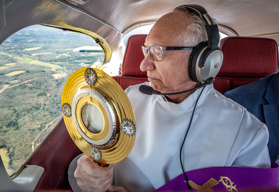 Deacon Tom Gerling offered eucharistic blessings to while soaring over parishes in the Festus Deanery on March 25.