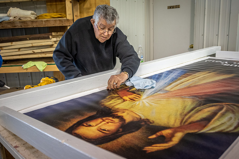 Bill Gegg from St. Francis Borgia Parish is part of an apostolate that constructs Divine Mercy devotional images, from small yard signs to four-foot by 9-foot barn side images, at their workshop in Washington.
