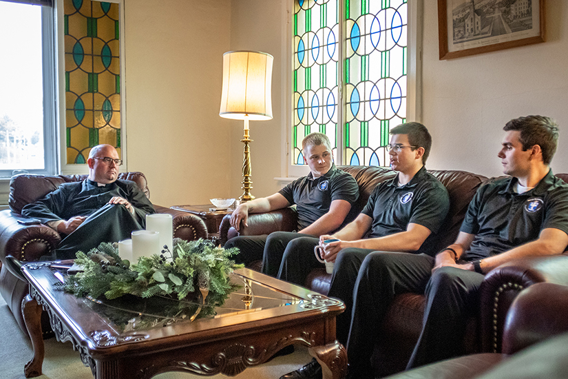 Father Edward Nemeth chatted with Kenrick-Glennon seminarians Jonah Darian, Jack McCoy and Jonathan Struckhoff in the parlor of the Ste. Genevieve Parish rectory.