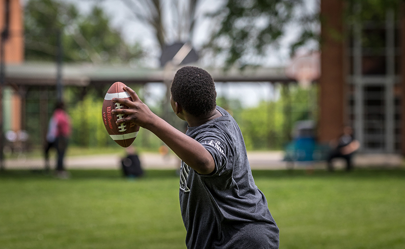 Boys at Marygrove in Florissant played football together on May 26. Marygrove, which provides treatment and support to young people struggling with emotional and behavioral issues, is supported by the Annual Catholic Appeal.