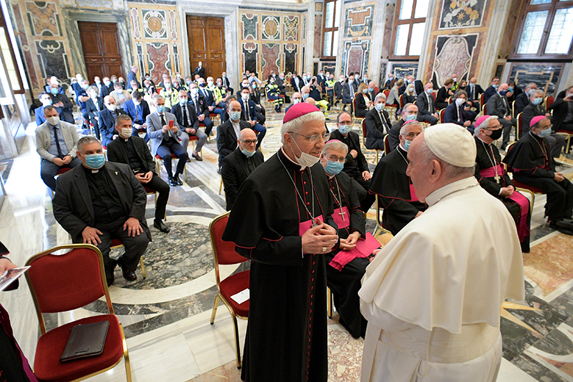 Pope Francis greeted a bishop during an audience with doctors, nurses and health care professionals from Italy’s Lombardy region at the Vatican June 20. The Lombardy region in northern Italy suffered the highest number of COVID-19 cases in the country.