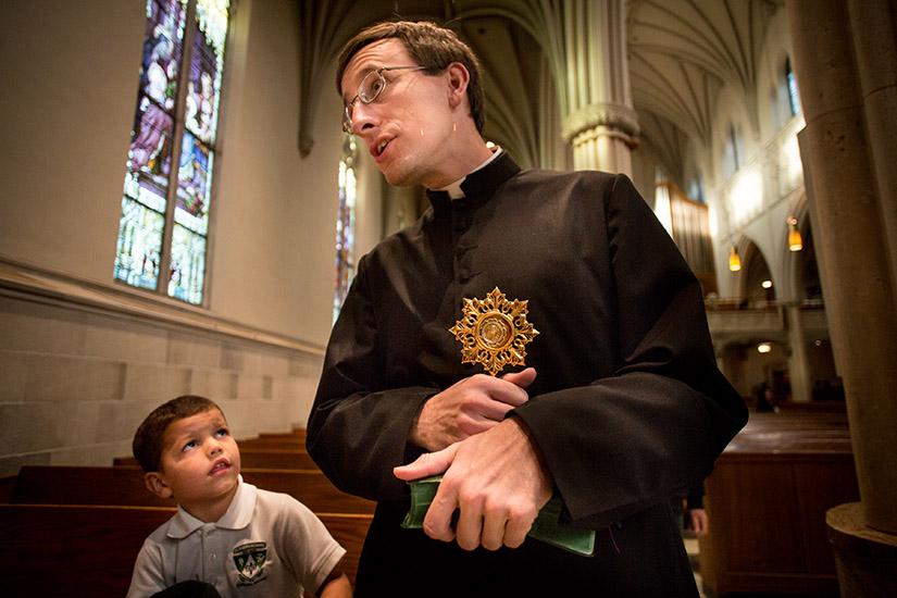 Father Anthony Gerber held a relic of St. Maria Goretti that wa given to him on his ordination day. He brought the relic to the Cathedral of St. Peter in Belleville, Ill., on a tour of other relics of St. Maria Goretti.