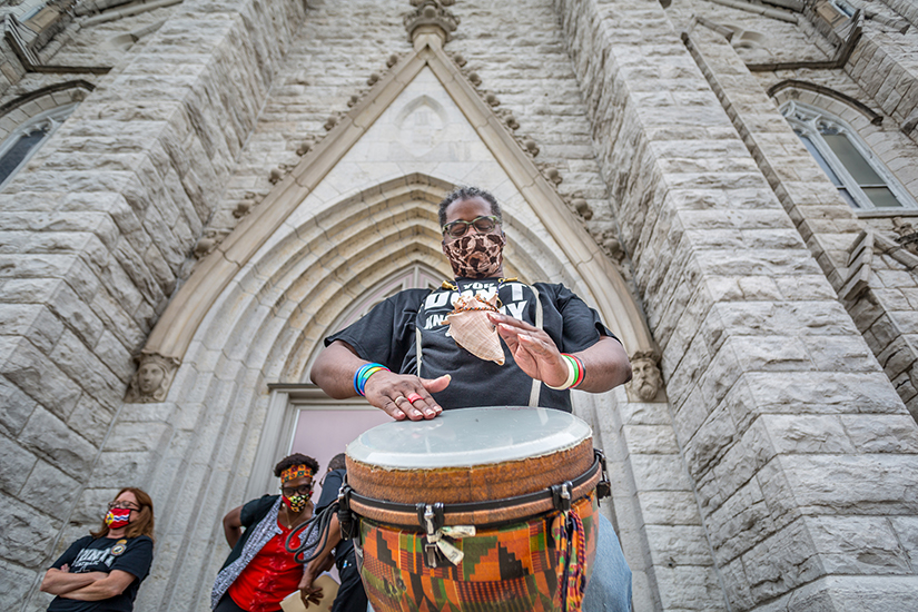 David A.N. Jackson played a djembe drum at the racial harmony vigil at St. Alphonsus Liguori “Rock” Church June 27.
