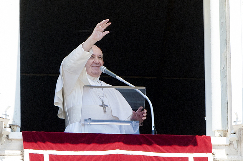 Pope Francis waved to the crowd in St. Peter’s Square from a window of the Apostolic Palace at the Vatican during his Angelus address July 26. Following the address, he urged young people to show grandparents and the elderly tenderness.
