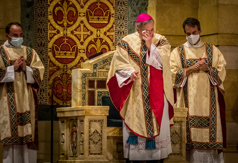 Archbishop Robert J. Carlson wiped his face at a Mass of Thanksgiving Aug. 23 at the Cathedral Basilica of Saint Louis. In the homily, Archbishop Carlson shared some of the ways he’s felt blessed during his time as Archbishop of St. Louis.