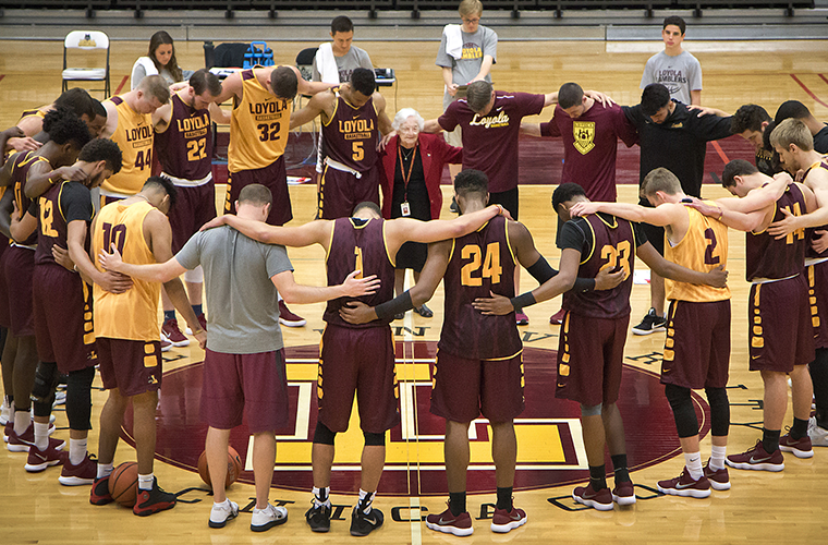Sister Jean Dolores Schmidt, 98, longtime chaplain of the Loyola University Chicago men’s basketball team and campus icon, prayed with the team in October 2017. Sister Jean credited pregame prayer and the players’ solid teamwork for the Ramblers’ thrilling last-second 64-62 NCAA Tournament win over the University of Miami March 15.