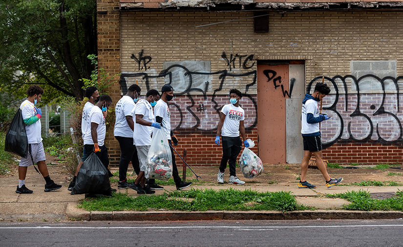 Students from Cardinal Ritter College Prep carried bags of trash they had collected along North Grand Boulevard Sept. 12. Students from Cardinal Ritter joined Operation Clean Sweep to clean up a more than two-mile stretch of North Grand Boulevard.