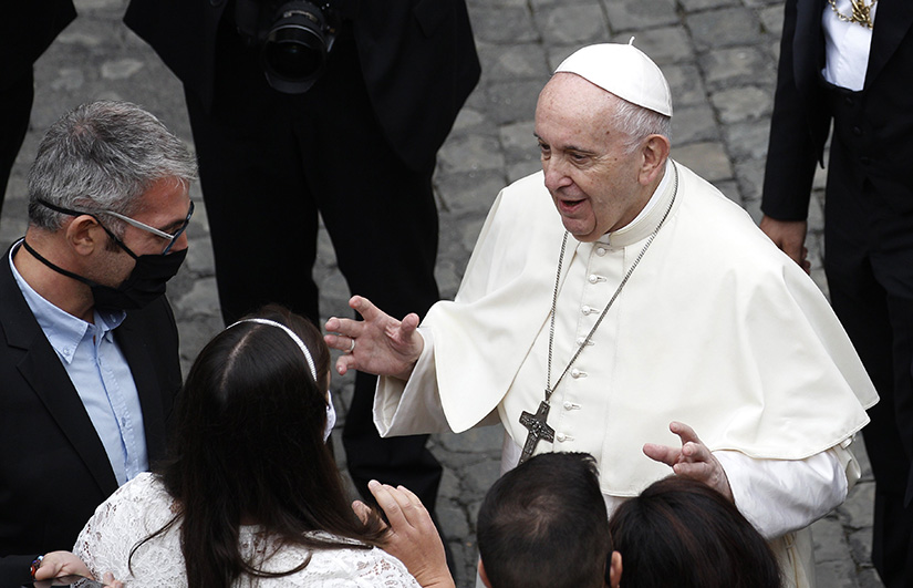 Pope Francis greeted people during his general audience in the San Damaso courtyard at the Vatican Sept. 30.