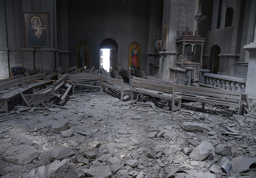Damaged pews lay amid rubble inside Holy Savior Cathedral in Shusha, Azerbaijan, Oct. 8, after shelling during a military conflict. Armenian Archbishop Raphael Minassian is pleading for European help in getting Armenia and Azerbaijan to cease fire in their conflict over Nagorno-Karabakh.