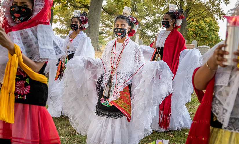 Lizett Mata, Alondra Salis, Yoselin Alvarado, Valeria Salis and Jessica Torres, parishioners at Our Lady of Guadalupe, danced traditional Mexican dances at a Día de Muertos (Day of the Dead) celebration at Sacred Heart Cemetery in Florissant on Oct. 8.