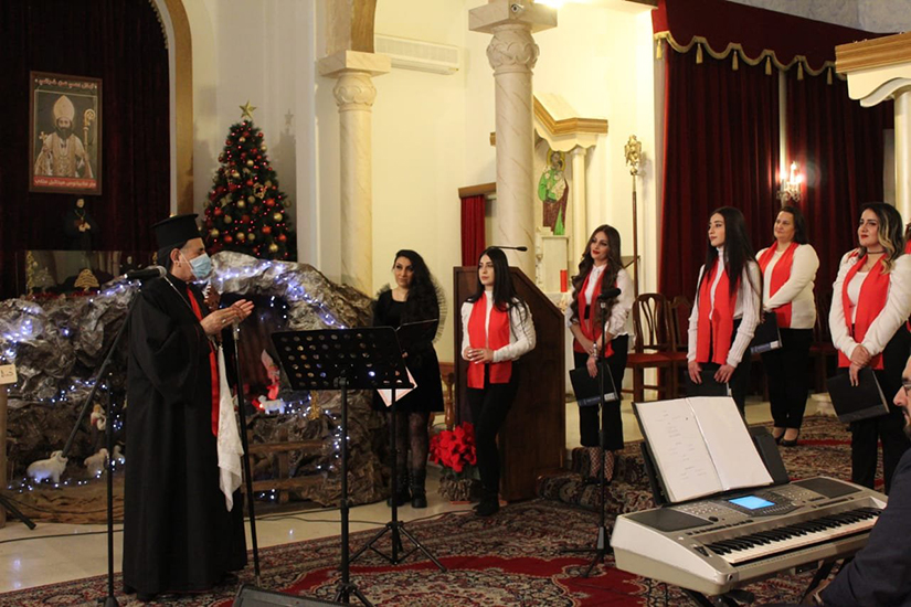 Syriac Catholic Patriarch Ignace Joseph III Younan spoke with the Holy Missionary Choir during a pre-Christmas celebration for Iraqi Syriac Catholic refugee families in Lebanon Dec. 12. The celebration was at Sts. Behnam and Sarah Church in Fanar, Lebanon.