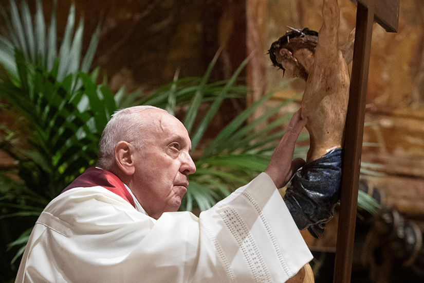 Pope Francis venerated a crucifix as he led the Good Friday Liturgy of the Lord’s Passion April 2 at the Altar of the Chair in St. Peter’s Basilica at the Vatican.