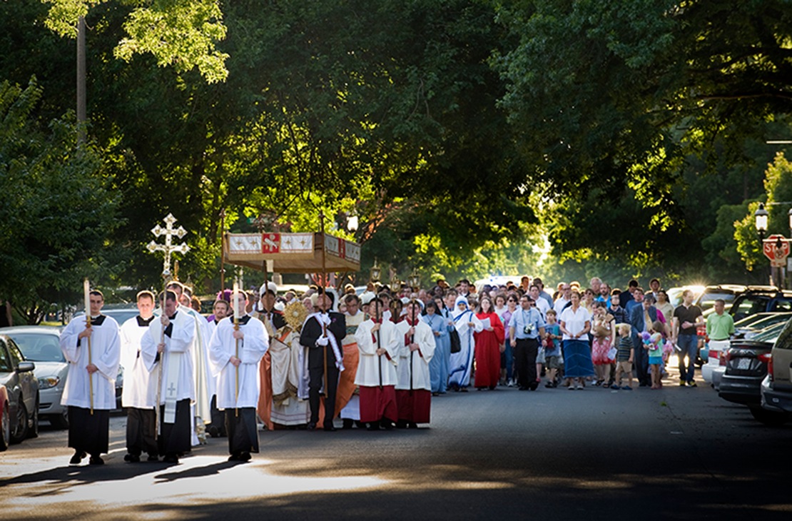 A Corpus Christi procession traveled through the streets of the Central West End to an outdoor altar for benediction. 