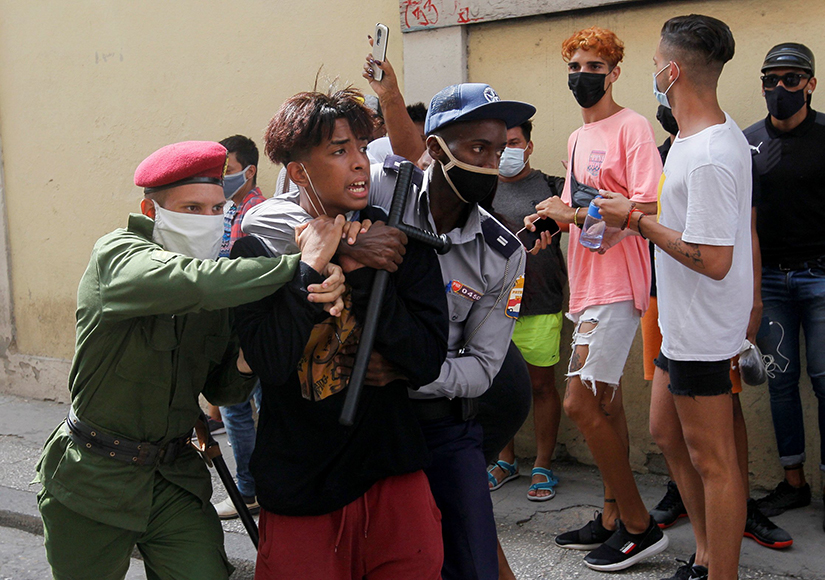 Police detained a person during protests in Havana July 11. Thousands of Cubans took to the streets to protest a lack of food and medicine as the country undergoes a grave economic crisis aggravated by the COVID-19 pandemic and U.S. sanctions.