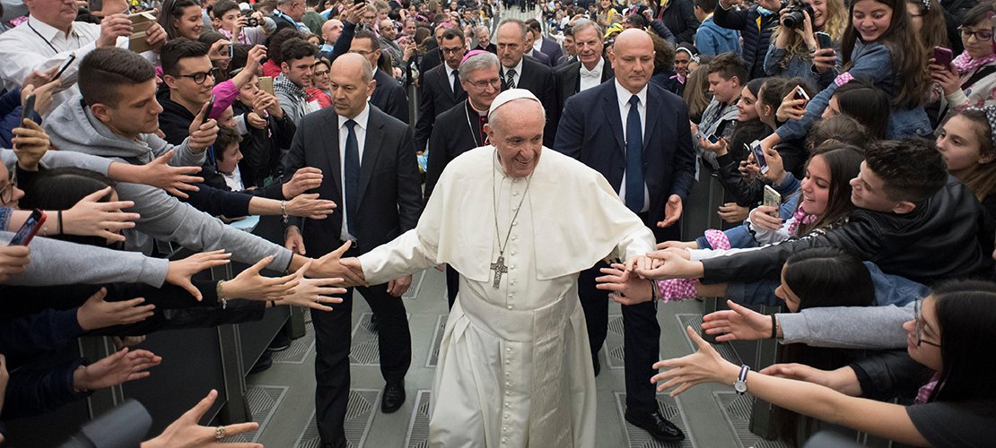 Pope Francis greeted young people as he left an audience with young people from the northern Italian Diocese of Brescia in Paul VI hall at the Vatican April 7.