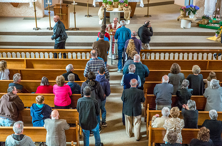 Parishioners at Immaculate Conception in St. Mary received the Eucharist in the church’s final Sunday Mass with Bishop Mark Rivituso on April 15.