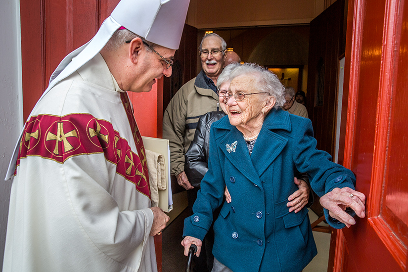 Bishop Mark S. Rivituso spoke with 94-year-old Bridget Griffard, known as the “Energizer Bunny” of the Immaculate Conception in St. Mary, as she exited the church after Mass April 15. Griffard received all her first sacraments at the parish and has until recently cooked the parish’s chicken and dumpling meals and belonged to the quilt club.