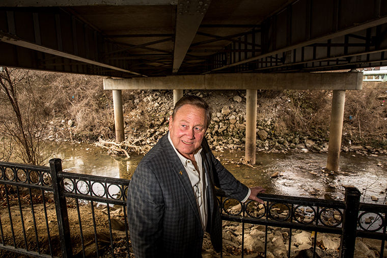 Mark Behlmann is a real estate developer in Florissant and a parishioner at St. Ferdinand. He is pictured along Coldwater Creek in Florissant on March 9. Coldwater Creek ran through the property where he and his wife raised their family. His wife passed away from stage 4 lung cancer eight years ago.