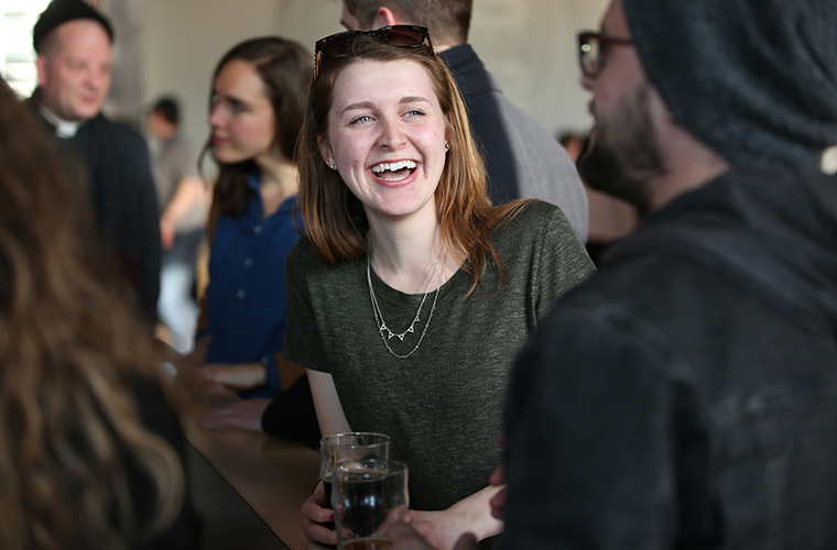 McKaela Laxen, center, talked with Nick Check at a Catholic Beer Club event at Able Seedhouse and Brewery in Minneapolis April 4.