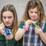 From paper bead bracelets to wooden toy cars, St. Roch students learn about resourcefulness of children in missions