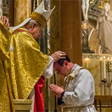 Archbishop Carlson ordains two men to sacred priesthood
