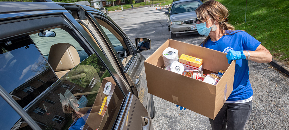 Volunteers distribute 1,000 boxes of food at Lemay parish