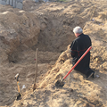 Papal almoner prays at mass grave in Ukraine