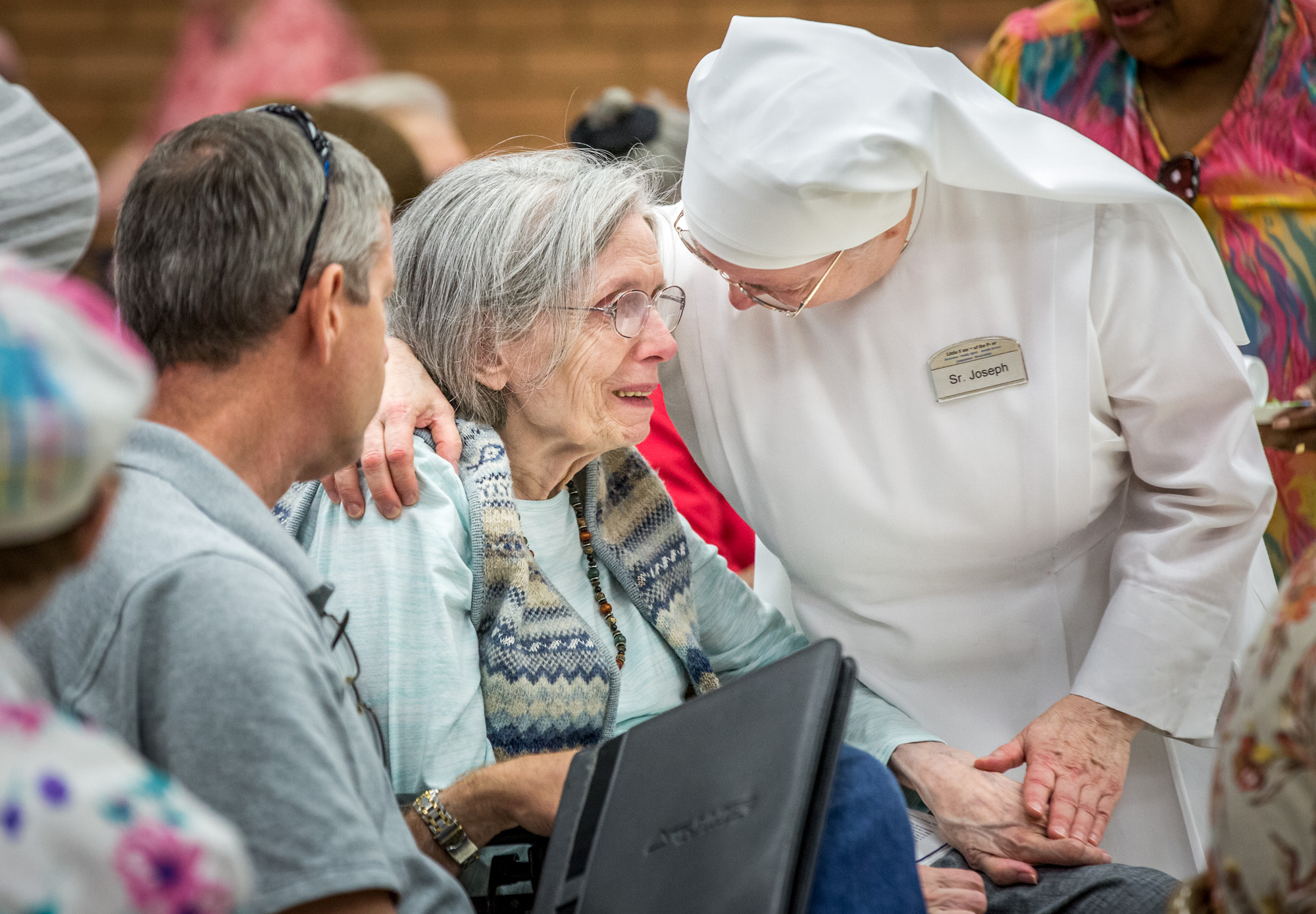 Little Sister of the Poor Joseph Hobin comforted 85-year-old resident Pat Whelan after the closure of the nursing home was announced July 6. The residence is expected to close by Oct. 31. 