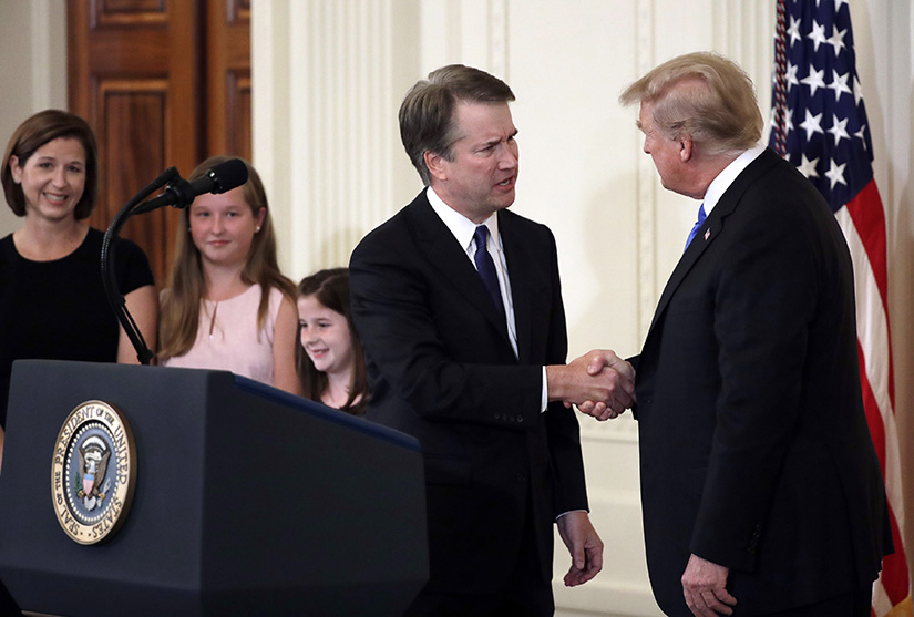 U.S. President Donald Trump nominated Brett Kavanaugh, a Catholic, to the Supreme Court on July 9 at the White House in Washington. At left is Kavanaugh’s wife, Ashley Estes Kavanaugh, and their two daughters, Margaret and Liza.