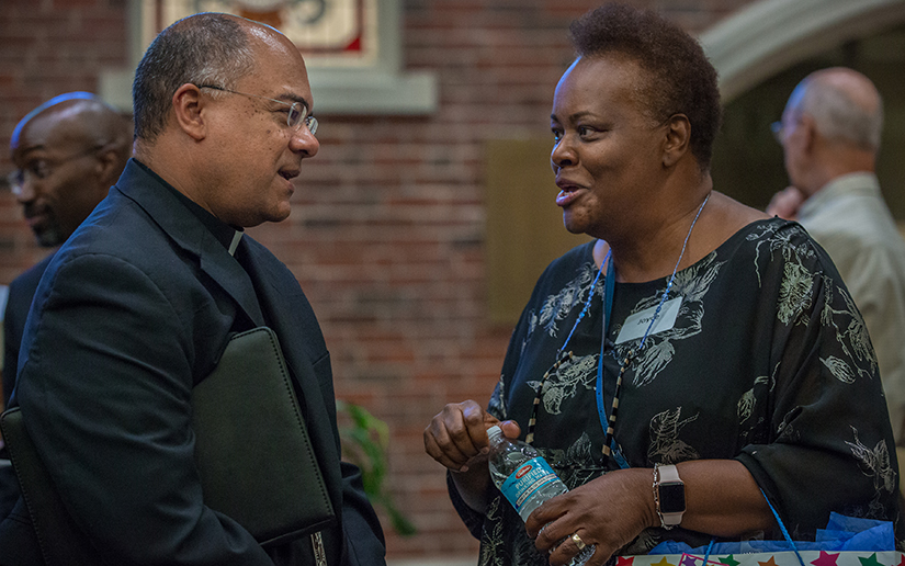 Joyce Jones, right, from St. Alphonus “Rock” Church, talked with Bishop Shelton J. Fabre of Houma-Thibodaux, La., after a meeting of the USCCB Ad Hoc committee listening session against racism held a at Saint Louis University on Aug. 17. Comments from the listening sessions across the country will be integrated into the application of the bishops’ upcoming Pastoral Letter Against Racism.