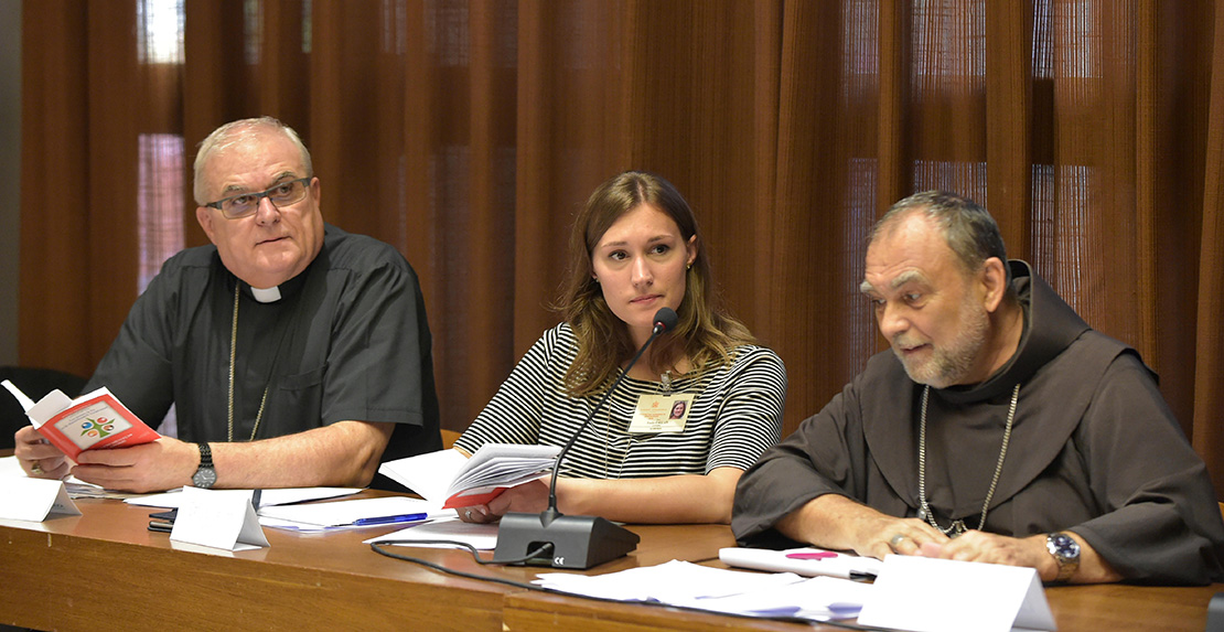 Emilie Callan, center, a synod delegate from Canada, attended a working group at the Synod of Bishops on young people, the faith and vocational discernment at the Vatican Oct. 10. Callan was a pre-synod delegate and works with Canada’s Salt and Light Television.
