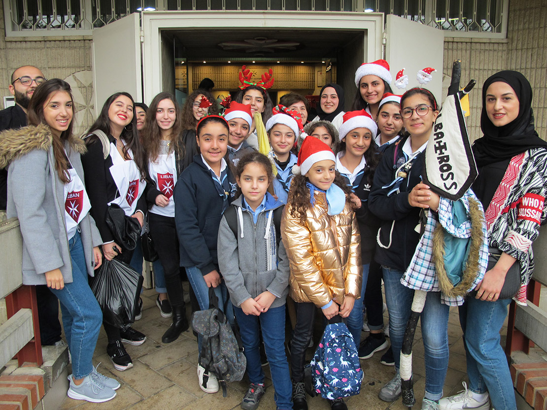 Volunteer youth from the Knights of Malta Lebanon, a Catholic organization, and “Who is Hussein,” a Muslim Shiite organization, as well as Girl Guides sponsored by the St. Vincent de Paul Society, gathered Dec. 8 at the Malta health center in Beirut before heading out to decorate the homes of poor elderly.