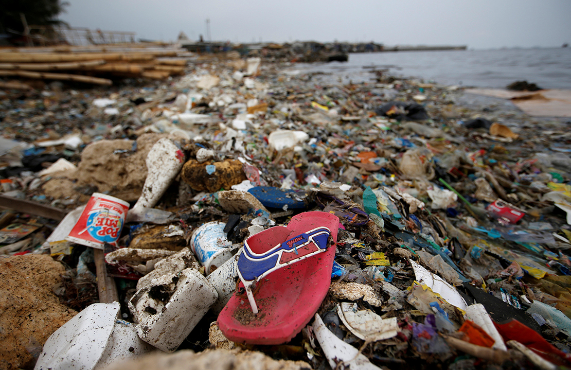 Plastic and Styrofoam garbage littered the shoreline in 2018 in Jakarta, Indonesia. Months after Indonesia’s military was summoned to unclog Jakarta Bay, Archbishop Ignatius Suharyo joined a chorus of disapproval of the nation’s growing plastic waste problem by calling parishioners to action.