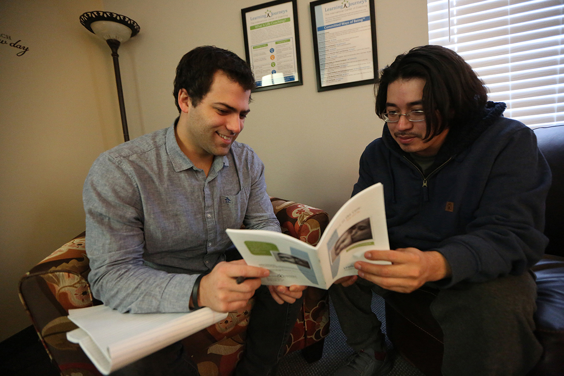 Luke Spehar, left, a certified life coach, talked with Allen Diaz in 2018 at Pregnancy Choices in Apple Valley, Minn. Diaz is participating in a program for expectant fathers.