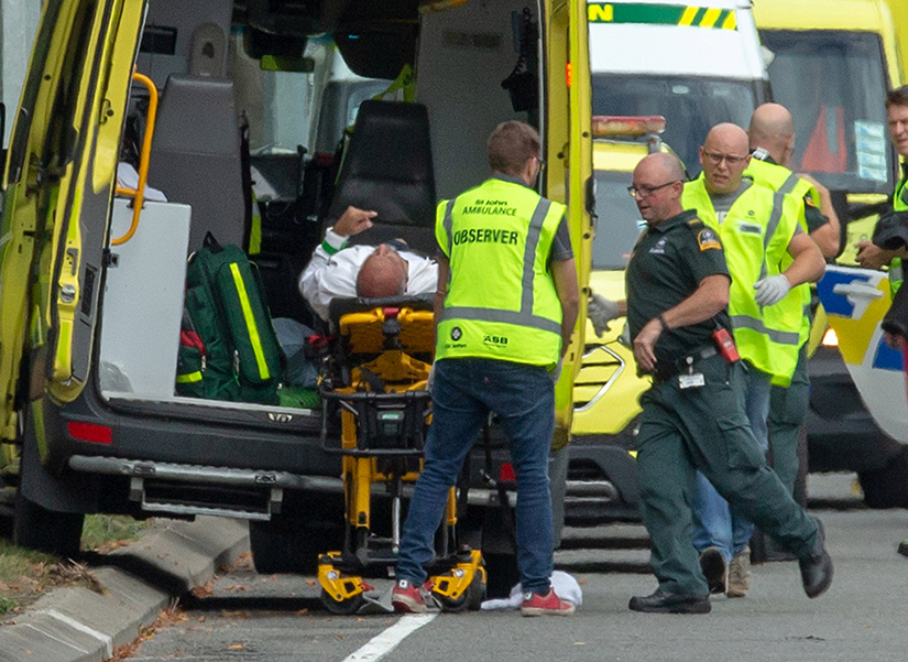 An injured man was loaded into an ambulance following a shooting at the Al Noor Mosque in Christchurch, New Zealand, March 15. New Zealand's Catholic bishops expressed their horror and distress at terrorist attacks on two mosques in Christchurch; at least 49 were people killed. 
