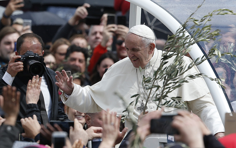 Pope Francis greeted the crowd after celebrating Palm Sunday Mass in St. Peter’s Square at the Vatican April 14.