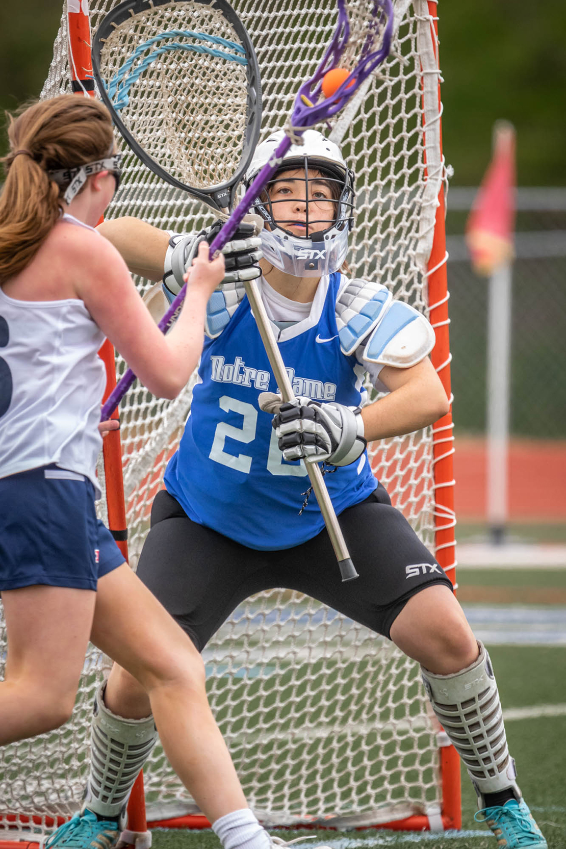 Notre Dame High School goalie Amelia Shaw fended off a shot by Parkway South’s Kayla Huelsmann. Notre Dame won the lacrosse game against Parkway South High School 7-2 at Parkway South High School on April 23.