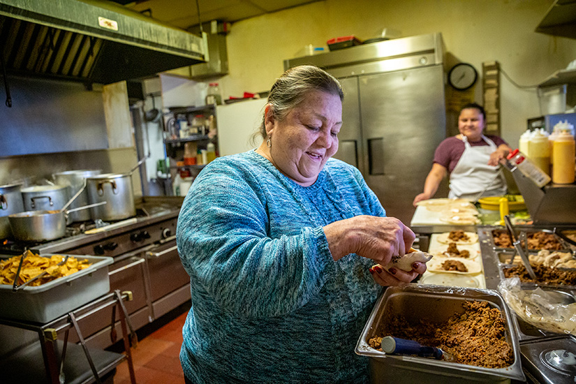 Bertha Morales prepared food for the celebration of Cinco de Mayo in her kitchen at Pueblo Nuevo Mexican Restaurant & Cantina in Hazelwood. The Morales family has been parishioners at Our Lady of Guadalupe Parish in Ferguson since it became a bilingual parish.