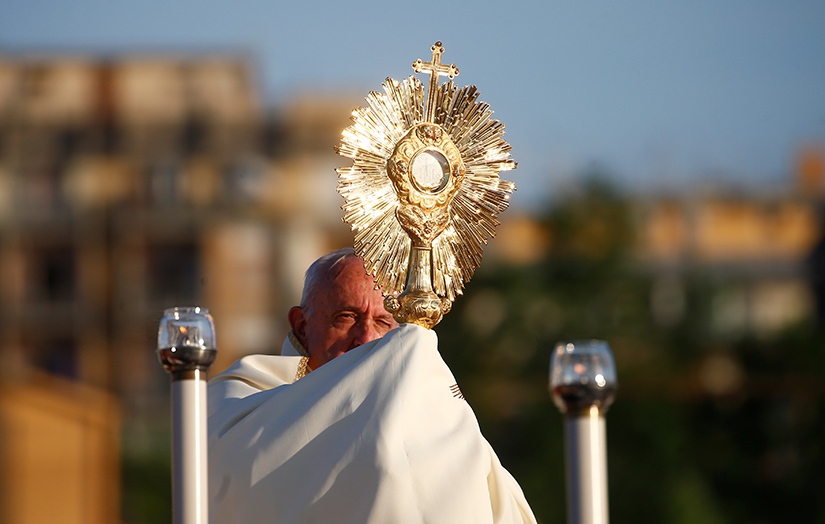 Pope Francis led Benediction as he marked the feast of Corpus Christi at the end of the Corpus Christi procession through the Casal Bertone neighborhood in Rome June 23.