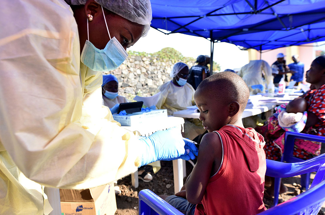 A Congolese health worker administered the Ebola vaccine to a child at the Himbi Health Center in Goma, Congo, July 15. The World Health Organization declared an emergency in Congo’s eastern provinces.