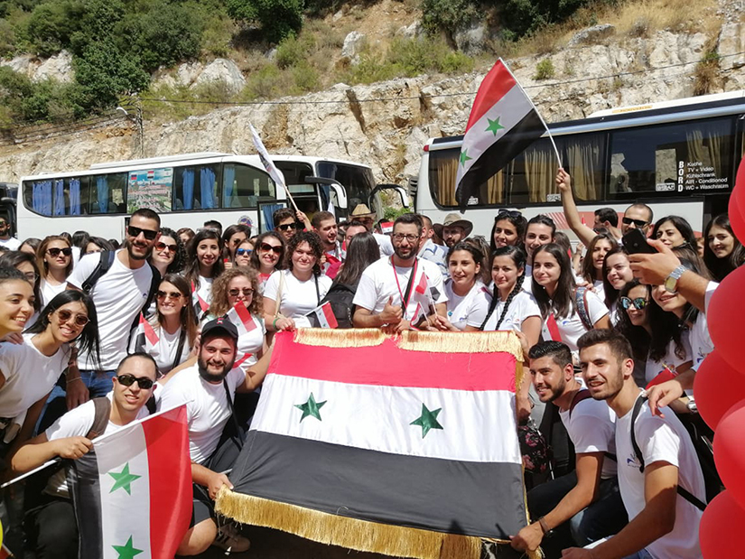 More than 100 young adults from Damascus, Syria, posed Aug. 9 after arriving at the Liqaa Conference Center near Beirut. Meeting under the theme, “To You I Say Rise,” more than 900 Melkite Catholic young people from the Middle East gathered in Lebanon for the first conference especially for them, hosted by the Melkite Patriarchate.