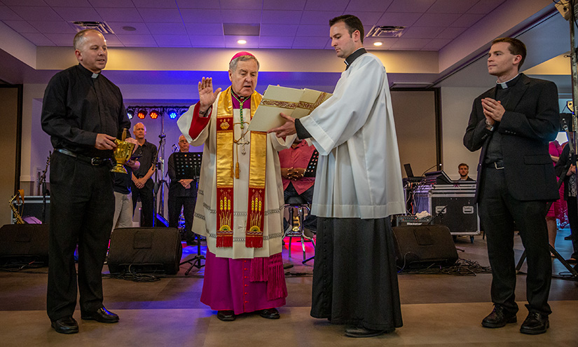 St. Joseph Parish pastor Father Daniel Shaughnessy, left, stood with Archbishop Robert J. Carlson as he blessed the new parish center at St. Joseph in Imperial on Aug. 23. Master of ceremonies, Father Zac Povis, and St. Joseph associate pastor, Father Thomas Vordtriede, stood to the right.