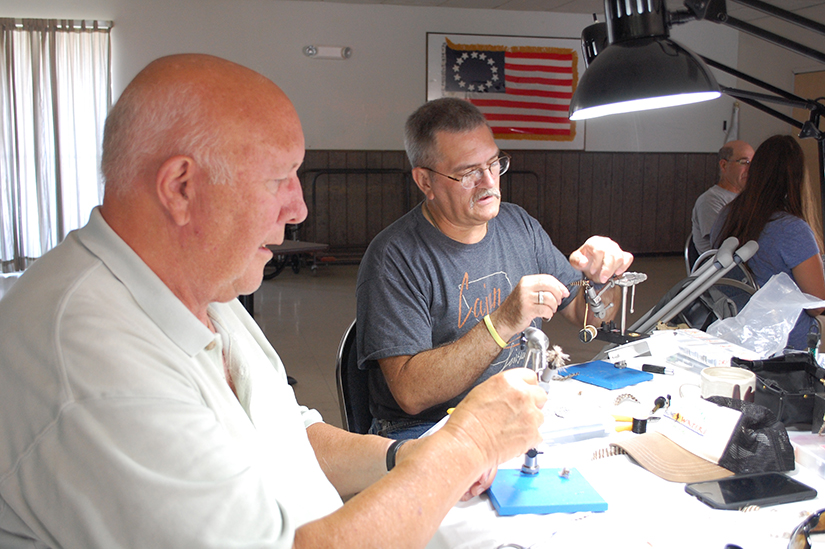 Dr. Leigh Wheeler, a U.S. Army veteran, and Cliff Lang, also an Army veteran, tied flies July 30 at the VFW with Vermont’s Burlington Project Healing Waters Fly Fishing group. 